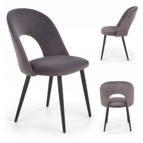   Luksuzna tapacirana stolica od baršunastog materijala u nijansama sive, idealna za dnevnu sobu ili blagovaonicu. Ova elegantna stolica Loft K384 kombinira udobnost i stil, savršena za glamurozne ili l