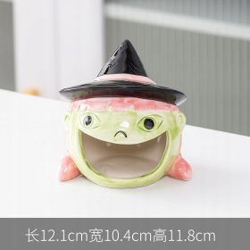    Metla za Noć vještica, šalica od bundeve, tanjur s voćem